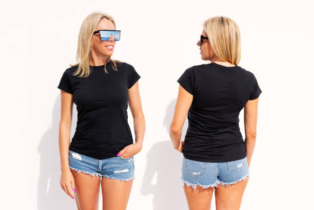 istock Woman wearing black t-shirt, front and back view 1384755039
