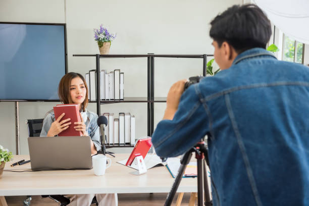 istock Behind the scene concept. Videographer talk to blogger 1384757203