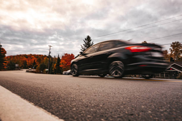 istock Car passing by through canadian parkland 1384765748