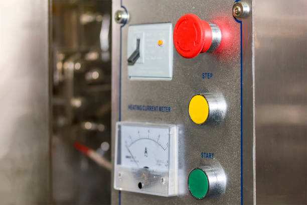 istock close up put button and emergency switch of control panel of high precision and automatic food packing machine for industrial 1384766863