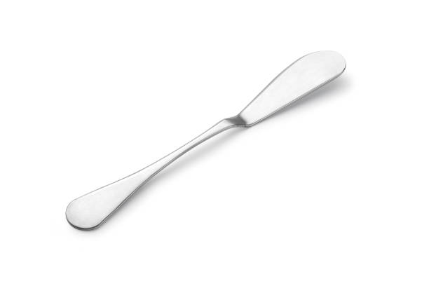 istock Knife spreads butter and jam on white background. 1384769547