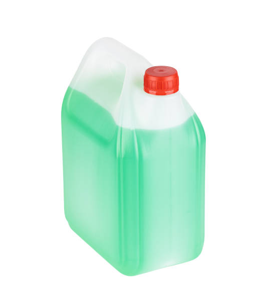 winter screen wash liquid can isolated on white background. green antifreeze bottle cut out stock photo