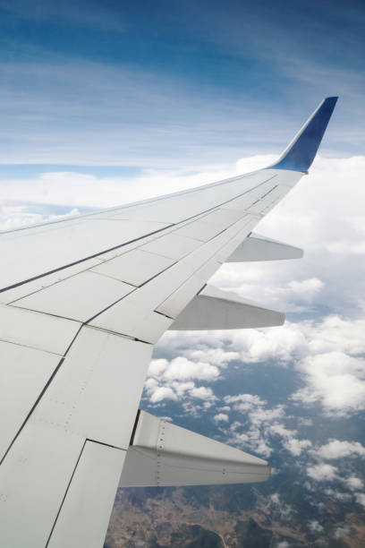 istock Airplane wing out of window 1384777250