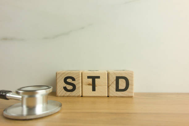 istock STD - Sexually Transmitted Diseases acronym from wooden blocks with stethoscope 1384777721