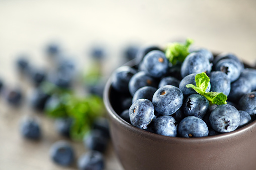 Fresh blueberries in a bowl. Healthy food concept.