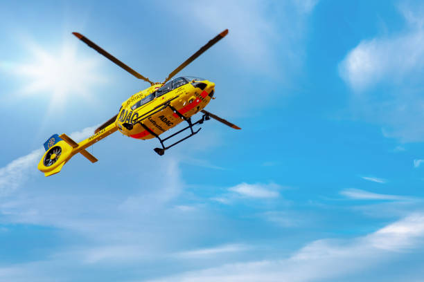 ADAC, Notarzt - Paramedic rescue helicopter against blue sky. Mainz, Germany - March, 2022: Emergency doctor. helicopter, flying ambulances, air ambulance in Germany. view from below. adac stock pictures, royalty-free photos & images