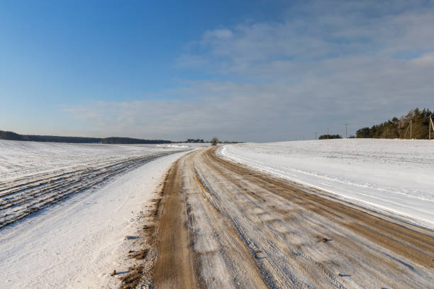 istock dangerous road in winter after snowfall, 1384786156