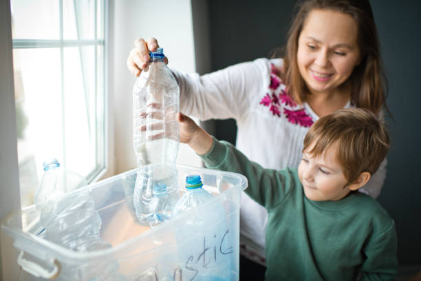istock Family  sorting out waste for recycling 1384795631