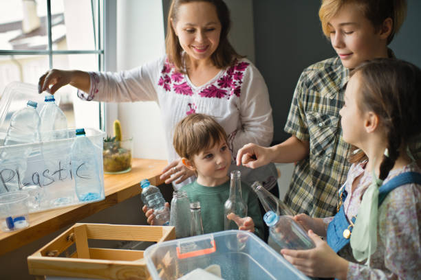 istock Family  sorting out waste for recycling 1384795650