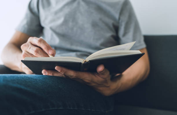 istock Man working or studying with book . Business and education concept 1384797226