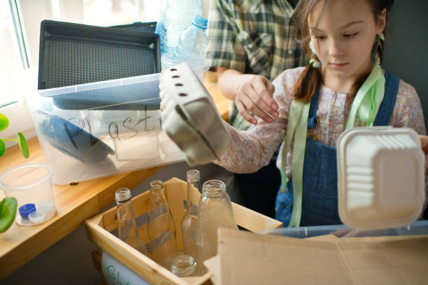 istock Family  sorting out waste for recycling 1384804460