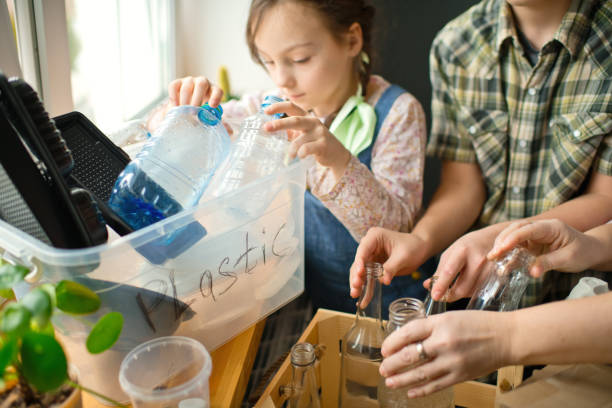 istock Family  sorting out waste for recycling 1384807402