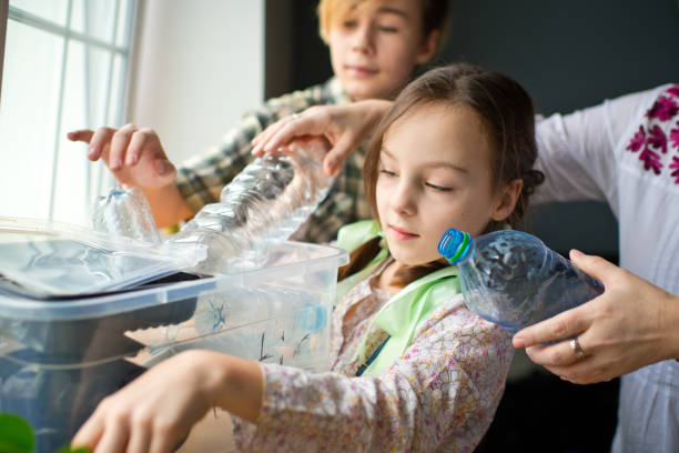 istock Family  sorting out waste for recycling 1384807437