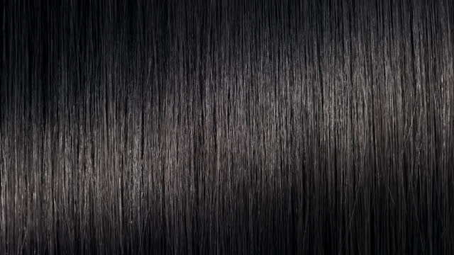 A wave passes through black hair