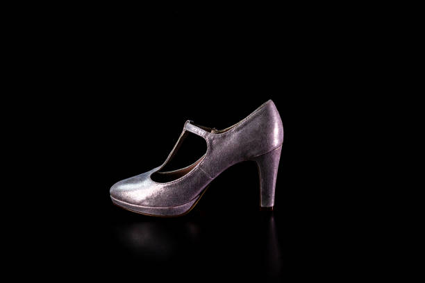 istock High heel women shoes isolated on black 1384817193