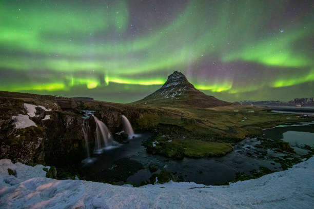 istock aurora borealis at Kirkjufellfoss waterfall, Iceland 1384819446