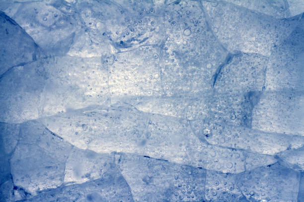 istock Ice frozen background with cracks on surface, texture 1384819523
