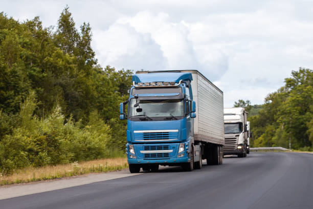 istock Trucks on a road in summer 1384820289