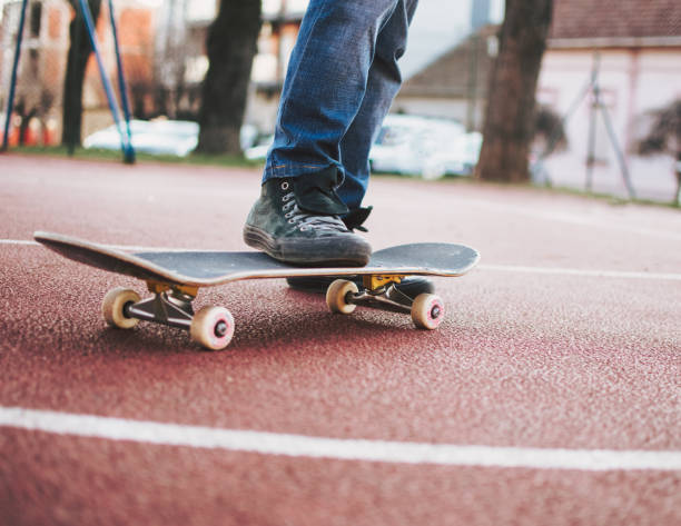 istock Crop teenage riding skateboard 1384822367