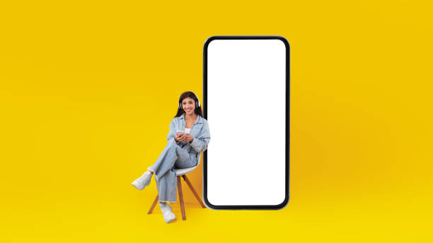 istock Happy lady using mobile phone at studio listening to music 1384825226