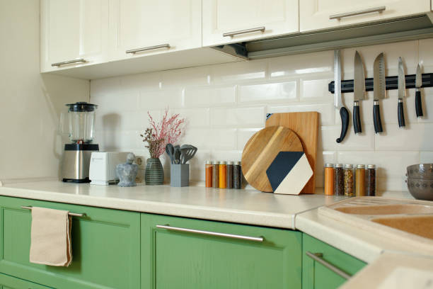 istock Cozy home kitchen work area with magnetic knives, cutting boards and other kitchenware 1384828477