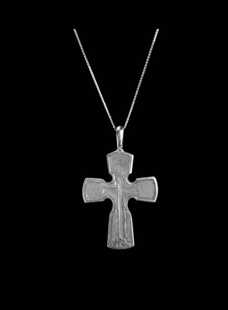 istock Silver crucifix necklace cross isolated on black background 1384830153