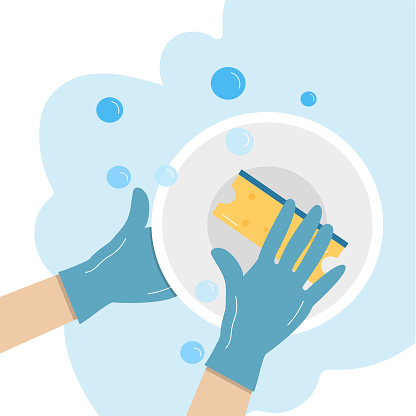 A hand in a rubber glove washes a plate