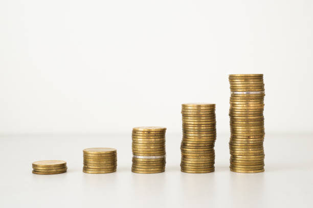 istock coin stack growth up isolated on white background. money saving, financial grow, business, economy budget and investment concept. 1384833135