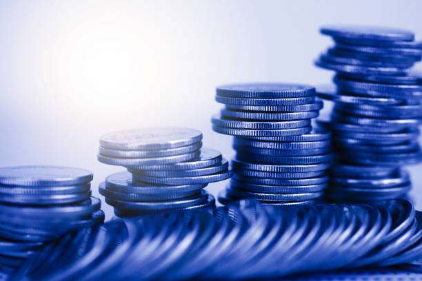 istock row of coin stack with double exposure background and light flare for financial banking and saving money and business stock investment concept. forex marketing trading. 1384833140