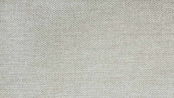 grey beige cashmere fabric in herringbone tweed pattern, virgin wool fabric texture use as background. expensive men's suit of fabric. interior drapery or upholstery background. grey beige cashmere fabric in herringbone tweed pattern, virgin wool fabric texture use as background. expensive men's suit of fabric. interior drapery or upholstery background. tweed stock pictures, royalty-free photos & images