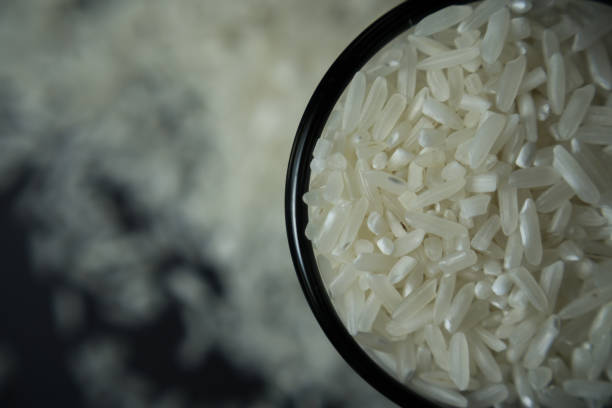 istock Top and side view of close-up photo white rice grain called 