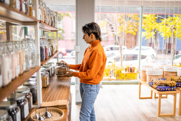 istock Young woman looking for healthy ingredients 1384835632