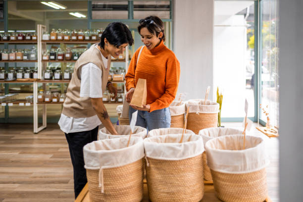 Friends buying snacks at local shop stock photo