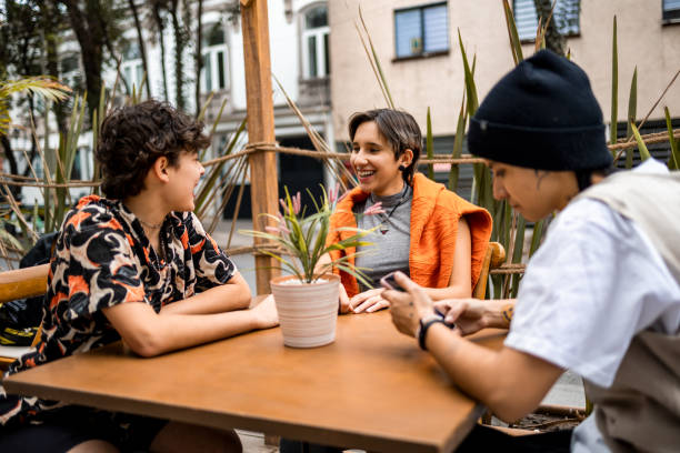 istock Friends sitting at the cafe 1384836813