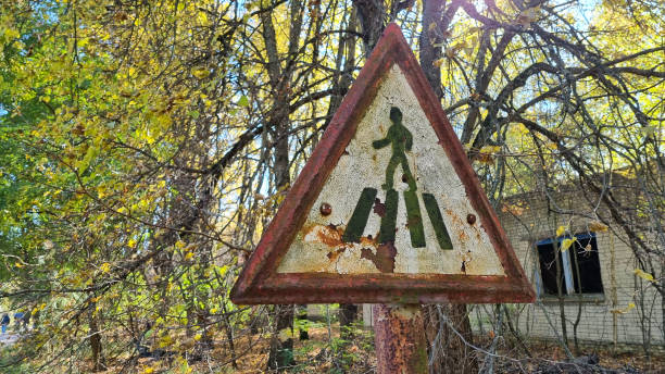 Rusty road sign of a pedestrian crossing