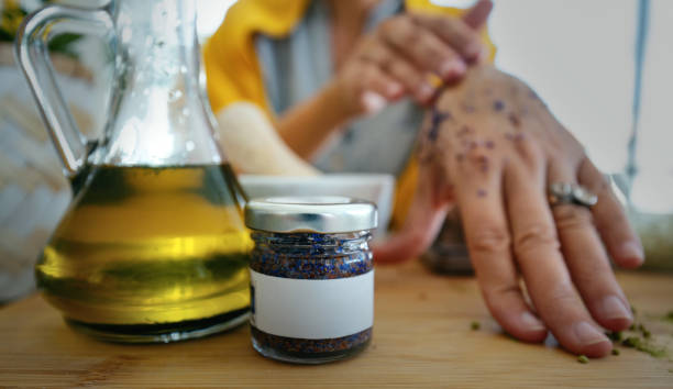 istock Unrecognizable woman applying hand scrub. 1384850681