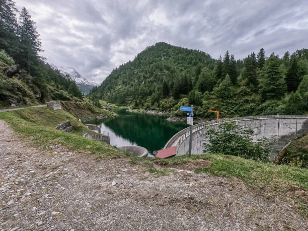 istock Dam and alpine lake in Switzerland 1384856180