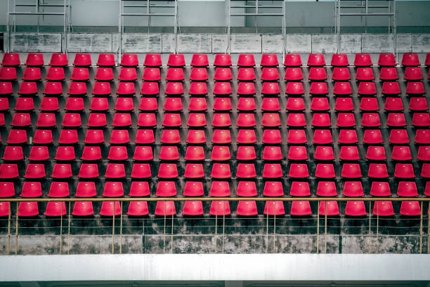 Chair in sport arena background Red amphitheater in areana, Bangkok, Thailand bleachers stock pictures, royalty-free photos & images