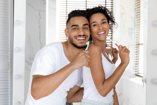 istock Happy Millennial Middle Eastern Spouses Brushing Teeth And Having Fun In Bathroom 1384859761
