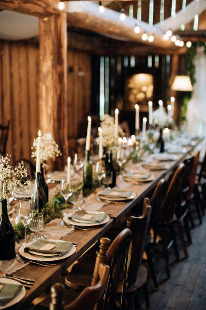 istock Decorating a festive table in a restaurant at a wedding party 1384859962