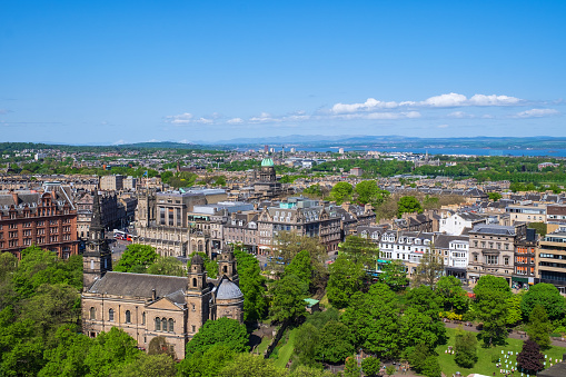 View of Edinburgh/Scotland with St. Cuthbert's Church in the foreground and the North Sea in the background