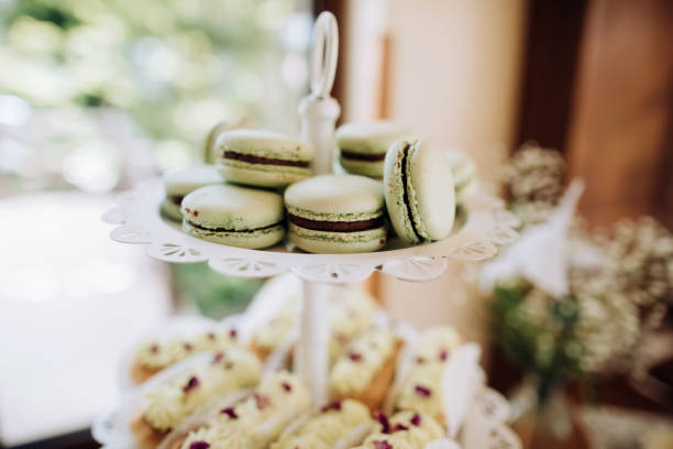 istock Green Macaroons on the dessert table at a wedding party. Sweets 1384860189