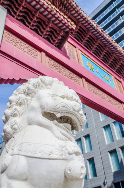 istock Lion sculpture besides the Montreal Chinatown gate 1384862395