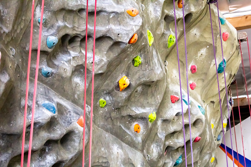 A view of an indoor rock climbing wall.