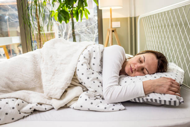 istock Woman sleeping at bedroom 1384863230