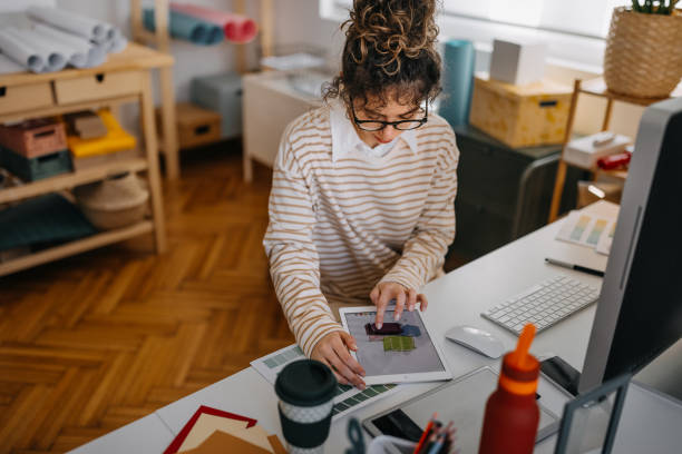 istock Businesswoman working over digital tablet 1384864459