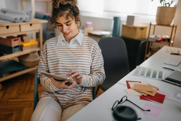 istock Young businesswoman using digital tablet 1384864525
