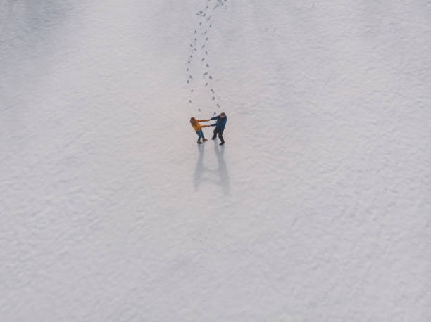 istock Happy couple enjoy in winter 1384864861