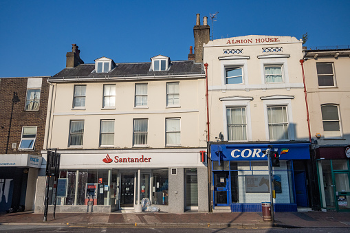 Santander Bank in Albion House on Grosvenor Road at Royal Tunbridge Wells in Kent, England, with other shops visible.