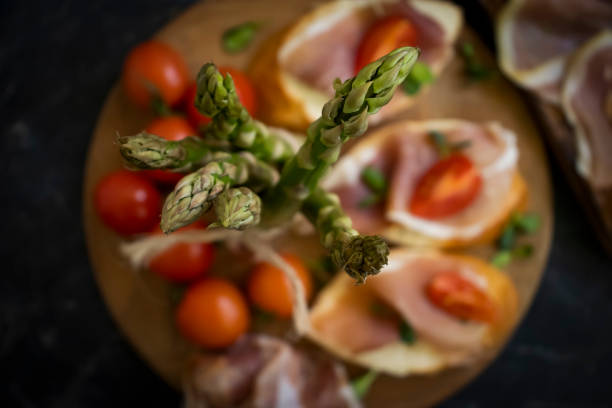 jamon sandwich, asparagus on old background
